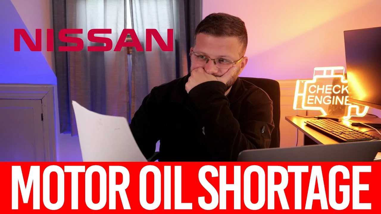 A presenter at a desk reading a printed Nissan technical bulletin, with the caption Motor Oil Shortage