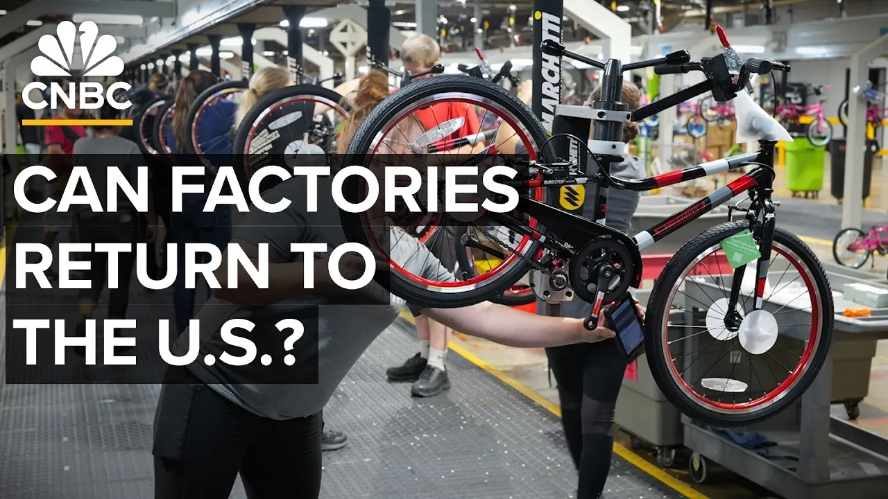 Bicycle frames moving through an automated assembly line at a US manufacturing plant